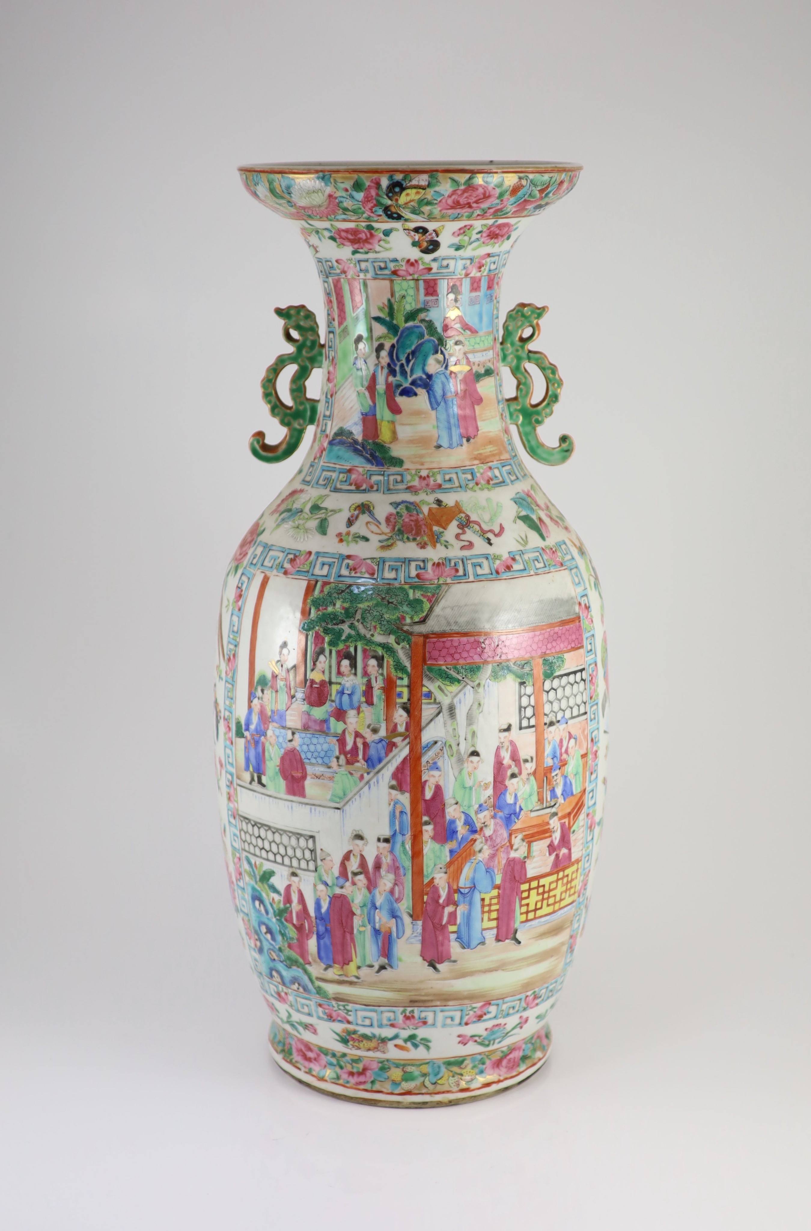 A pair of large Chinese famille rose twin handled vases, mid 19th century, 60 cm high, one vase broken and repaired